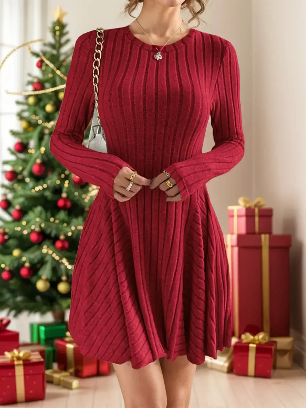 Woman wearing Ribbed Round Neck Long Sleeve Dress in red near Christmas tree and gifts, highlighting festive style.