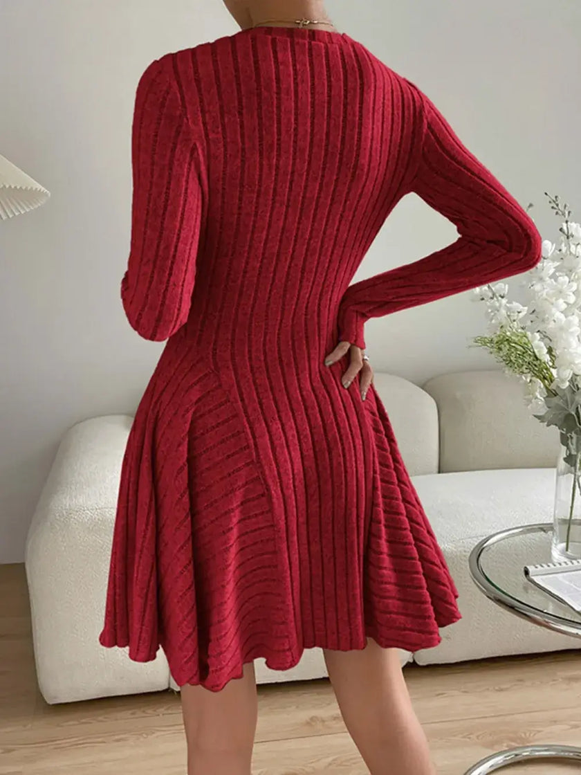 Back view of Ribbed Round Neck Long Sleeve Dress in red, highlighting its textured and slightly stretchy fabric.