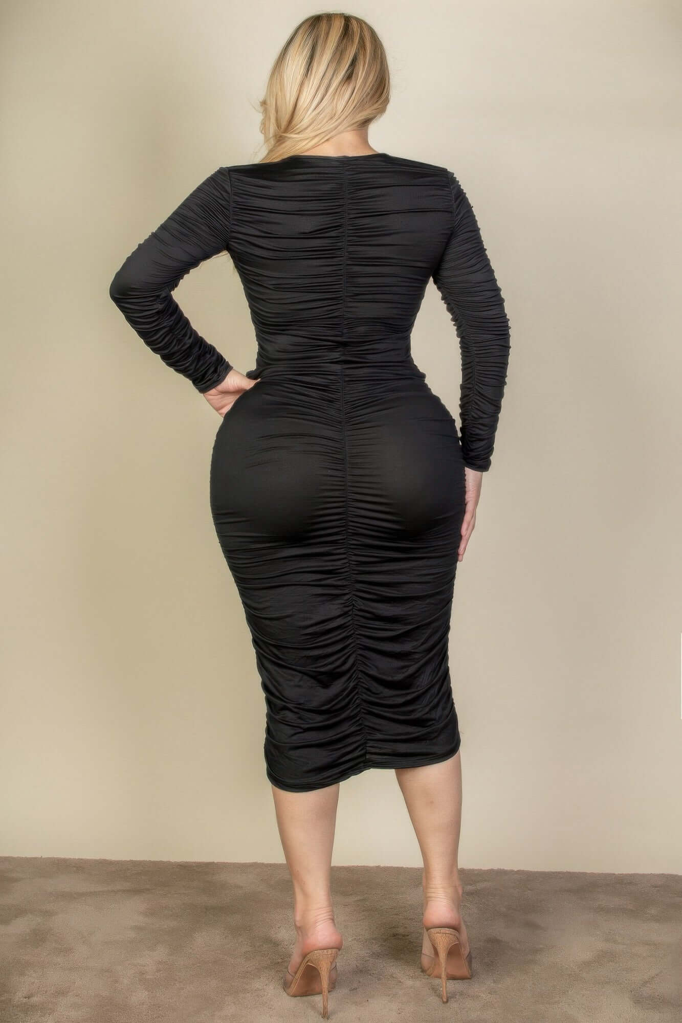 Back view of Plus Size Ruched Long Sleeve Midi Dress in black, highlighting ruched detailing and comfortable fit.