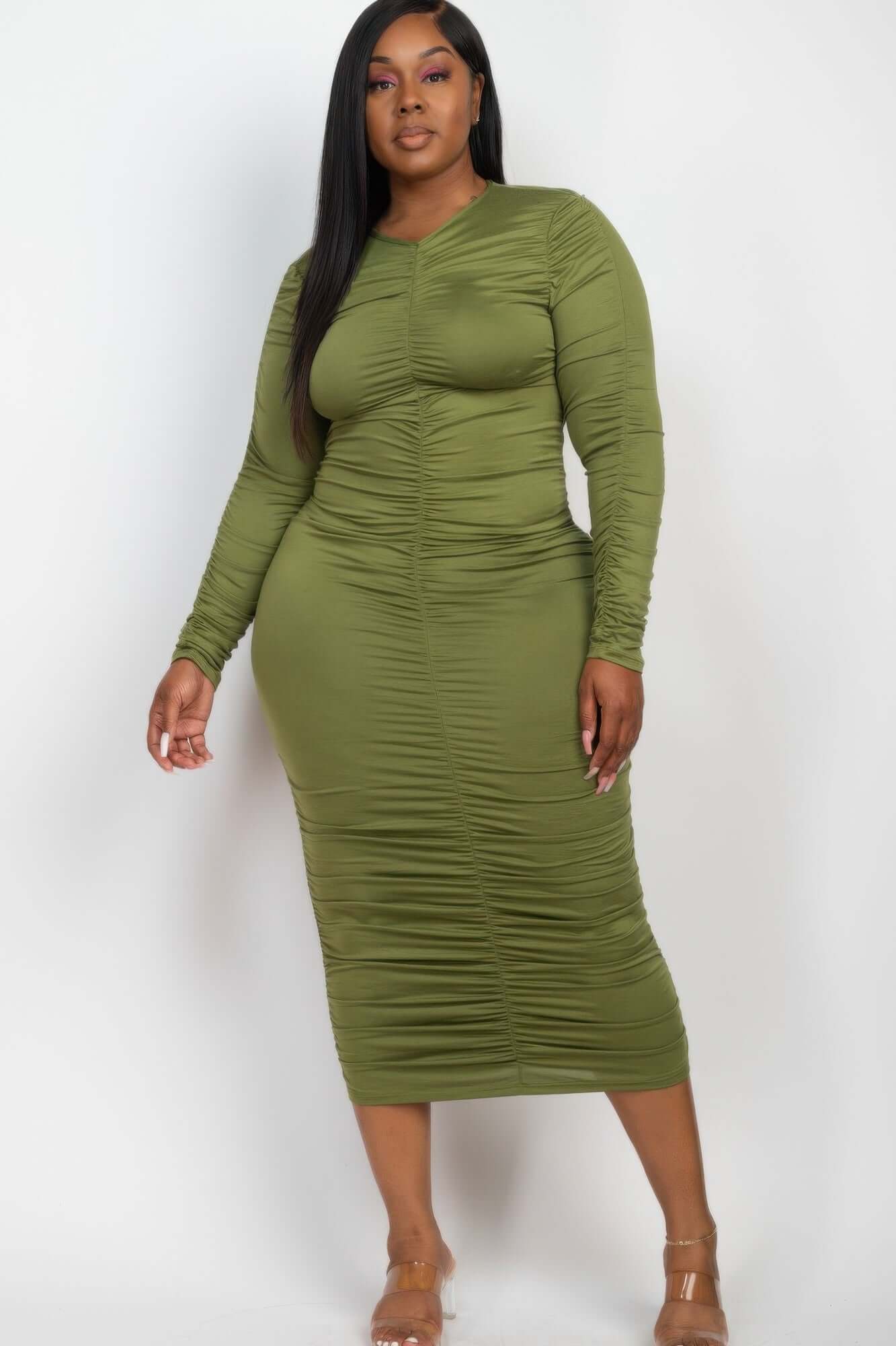 Plus Size Ruched Long Sleeve Midi Dress in green worn by model.