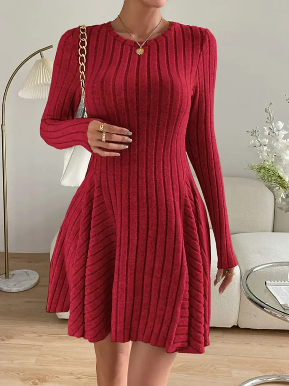 Ribbed Round Neck Long Sleeve Dress in red with slightly stretchy fabric, polyester-spandex blend, displayed in a stylish living room setting.