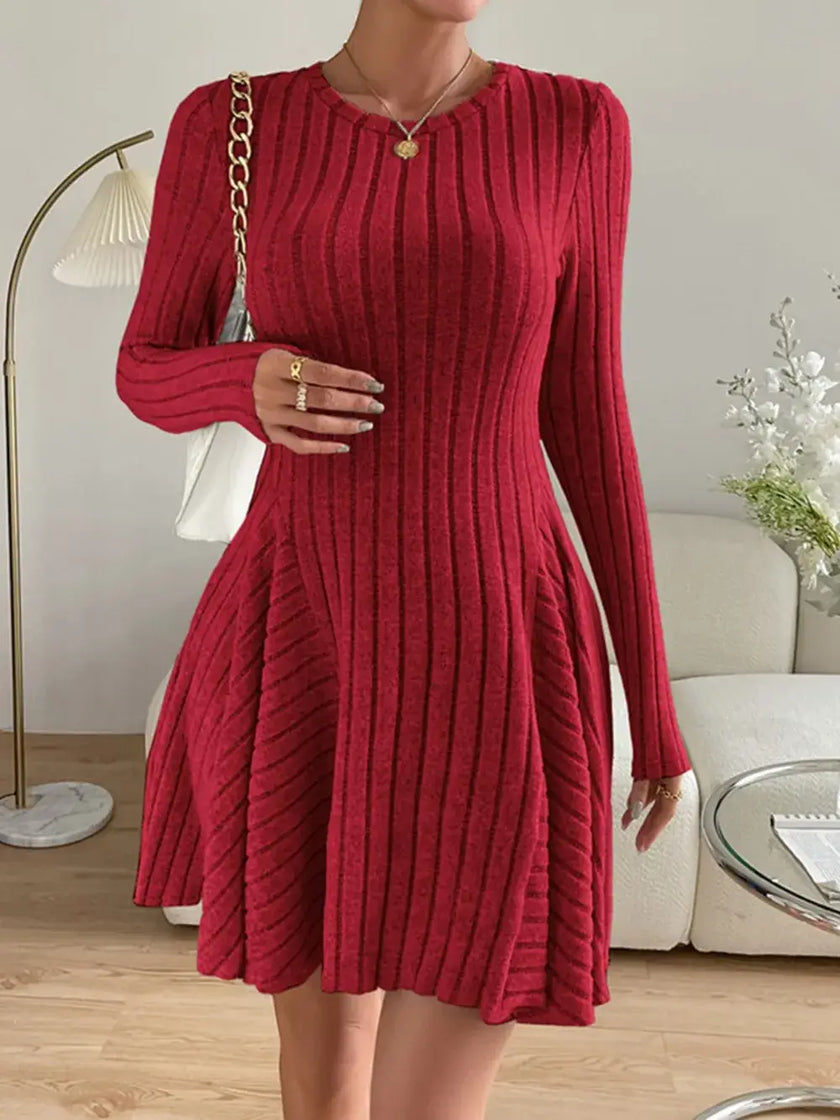 Ribbed Round Neck Long Sleeve Dress in red with slightly stretchy fabric, polyester-spandex blend, displayed in a stylish living room setting.